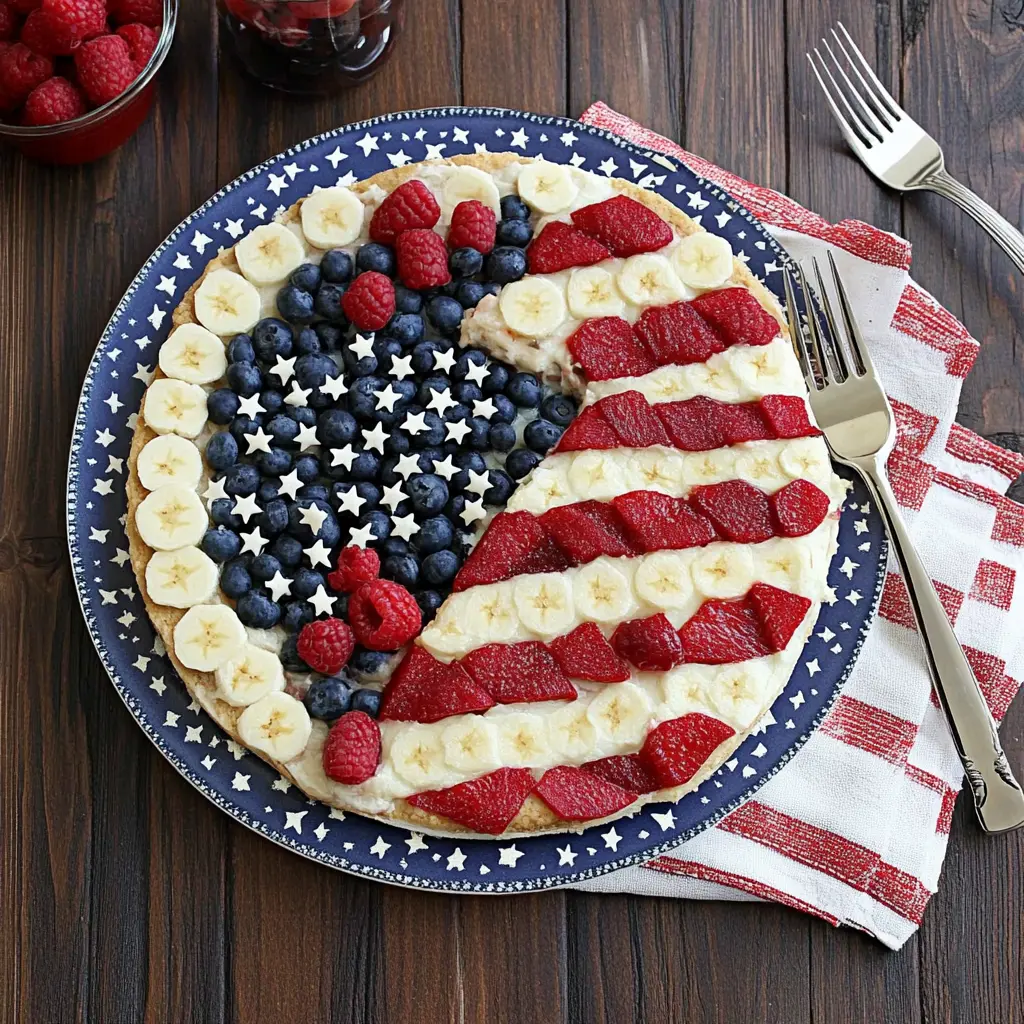 American Flag Fruit Pizza with sugar cookie crust, cream cheese, and berries