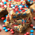 Fireworks Blondies: A Colorful Celebration of Flavor 4 Fireworks Blondies with colorful M&Ms and sprinkles.